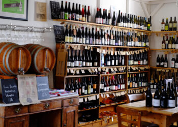 A selection of biodynamic wines on display at wrights emporium in llanarthne, carmarthenshire, wales, showcasing a variety of sustainable and organic wine options.